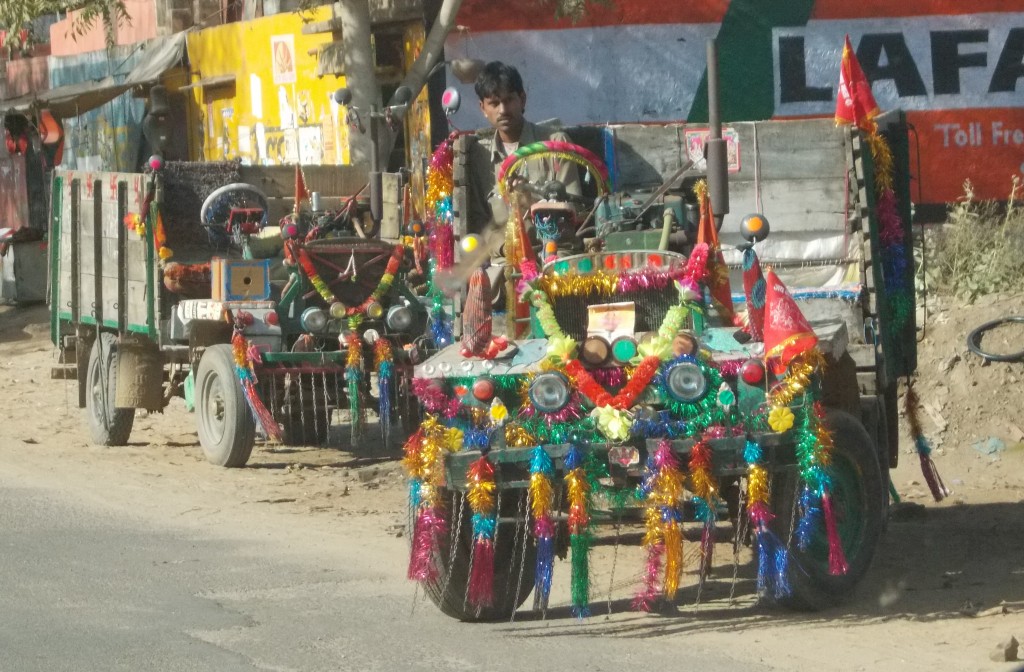 These vehicles, called Jugaad (meaning thrown together or hack), have to be seen to be believed.  Seat a wooden box, wheels from 4 different vehicles, engine a water pump.