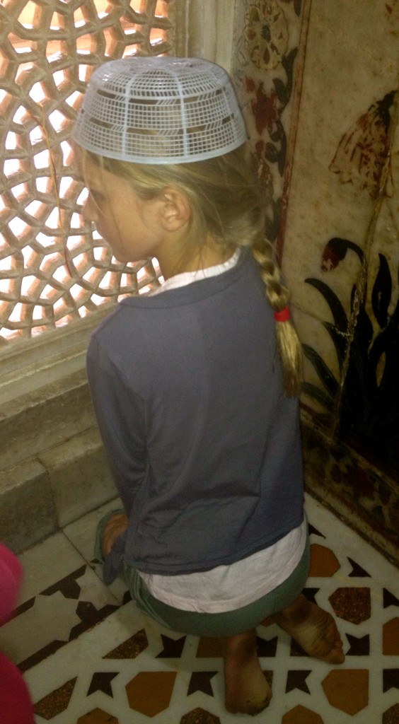 There is a beautiful small white marble tomb inside the mosque.  Pilgrims travel to make wishes at the shrine by tying knots in strings on the marble screens.  The kids each made 3 wishes.  