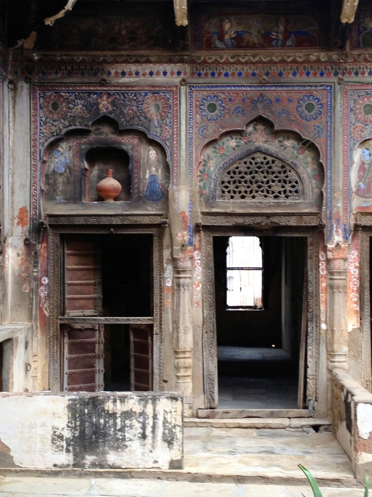 Inside of haveli before renovation.  Walls are blackened from kitchens and oil lamps.