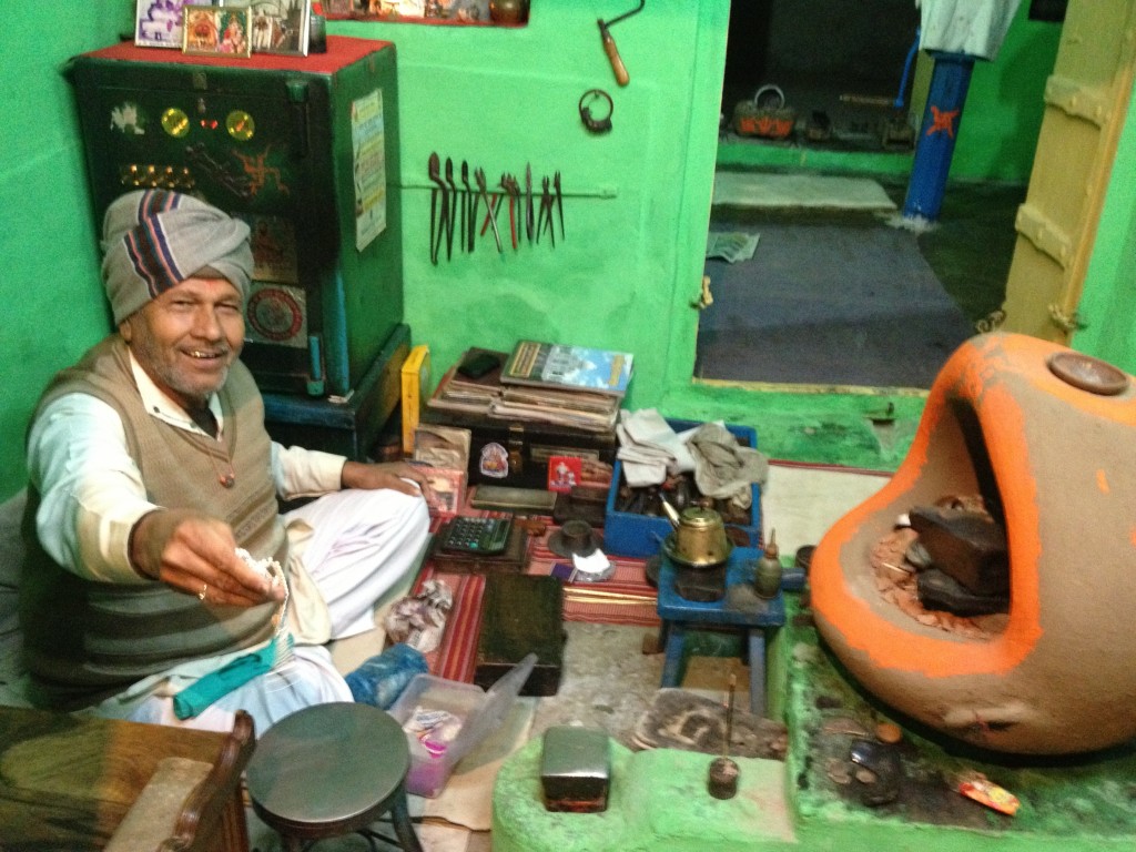 Jeweller/silversmith in his colourful workshop in a small village in North Rajasthan.  All his techniques and tools are unchanged in the past couple of hundred years.