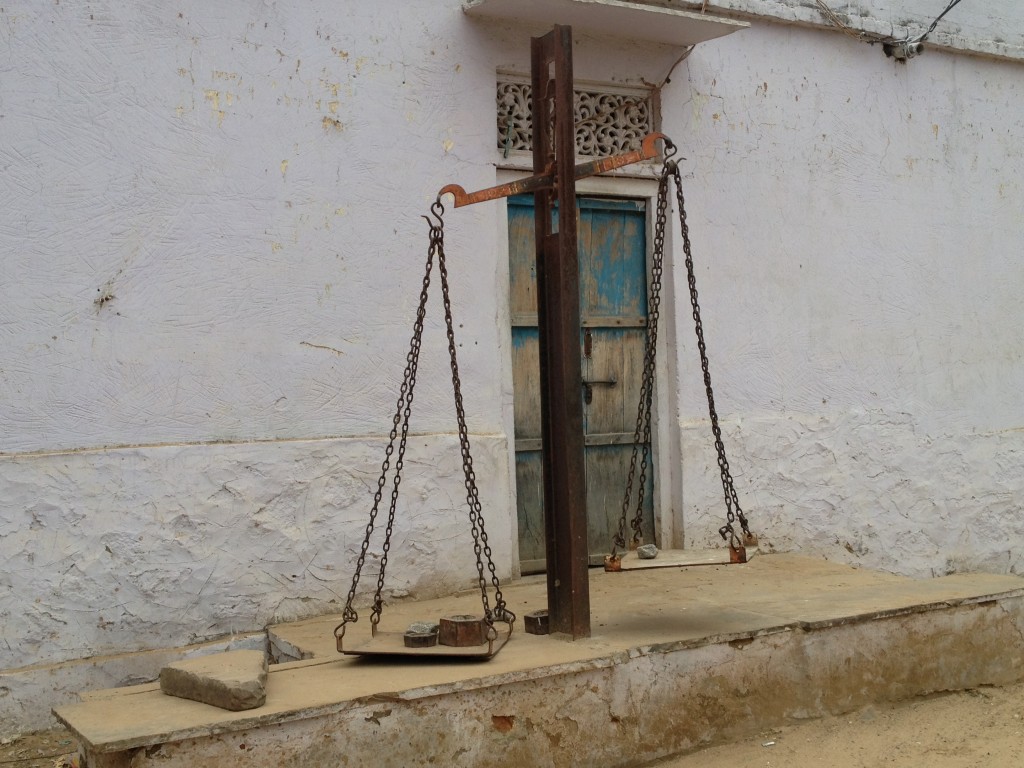 Scales in use outside a flour mill.
